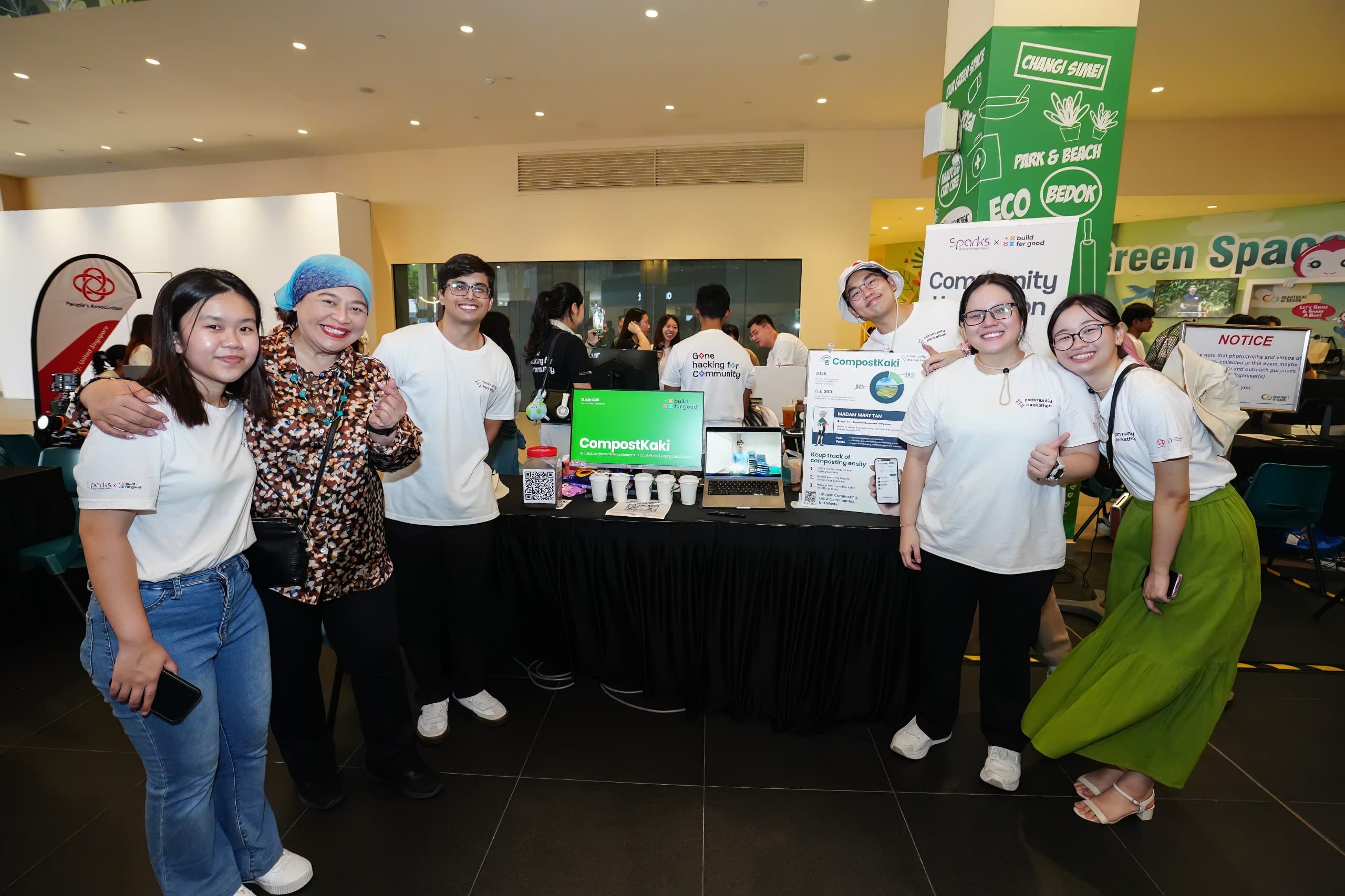 CompostKaki Team with their booth at Build for Good 2025